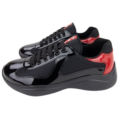 prada shoes black red